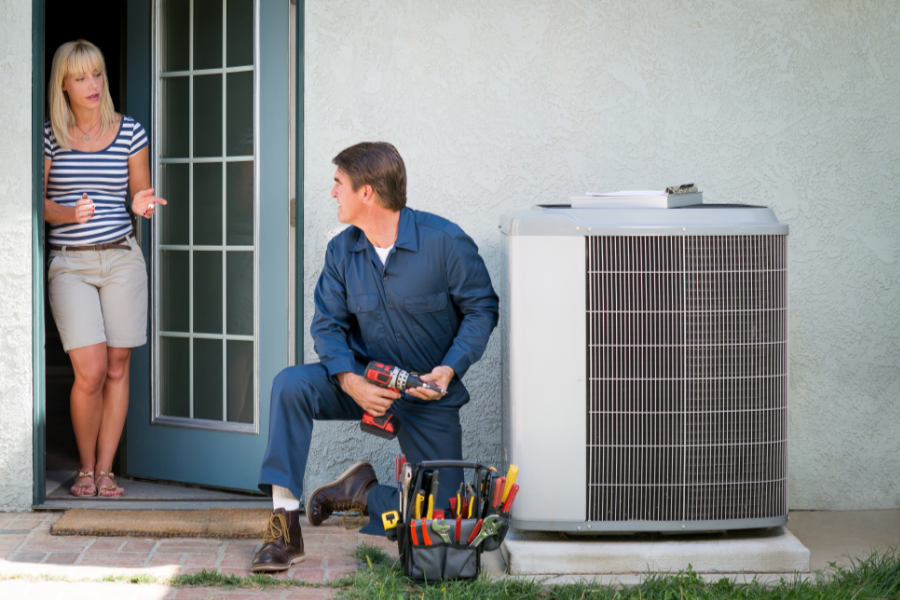 technician explaining the FAQs about the new AC regulations with a customer|