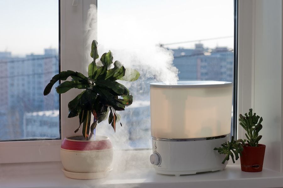 Image of a humidifier by a window.