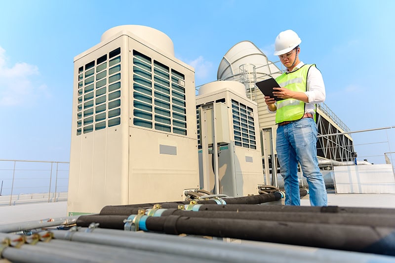 What Are the Benefits of Commercial HVAC Maintenance? Air conditioning units on a commercial building.