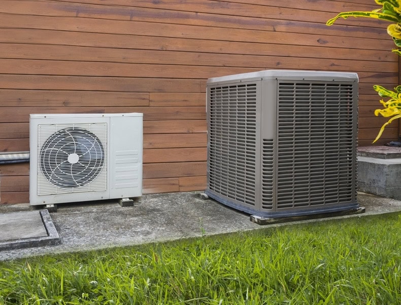 Air Conditioning Heat Pump on side of home showing how it works