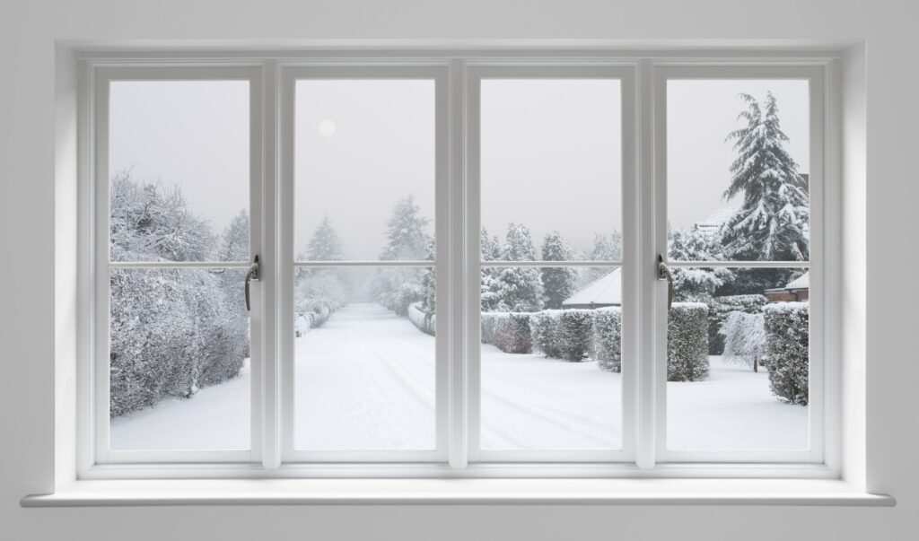 Snowy Road Through Warm Home's Window|