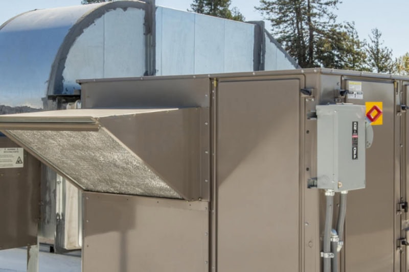 What to Do: Commercial Heating Equipment Breaks Down. Photo of a heating unit installed on a rooftop of a commercial building.