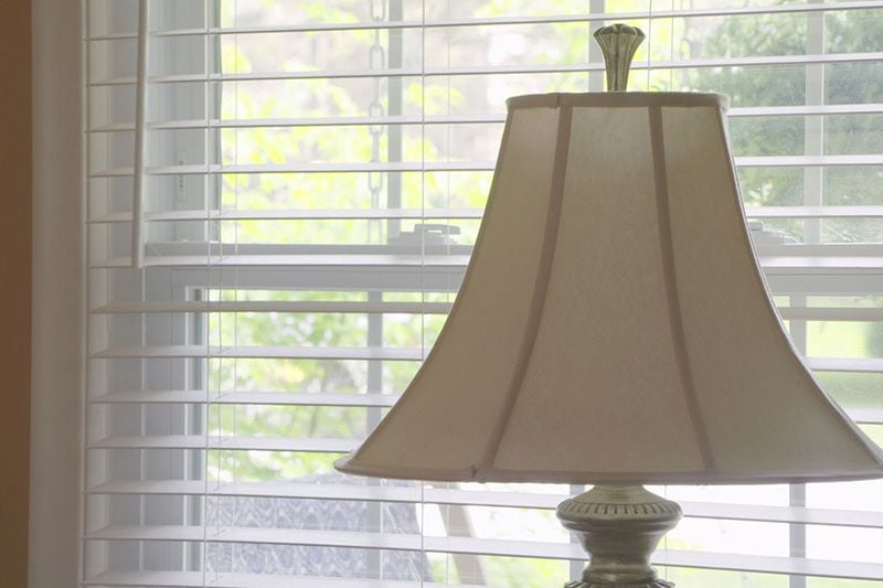 Image of a lamp by a window. Video - Energy Saving Tip 4.